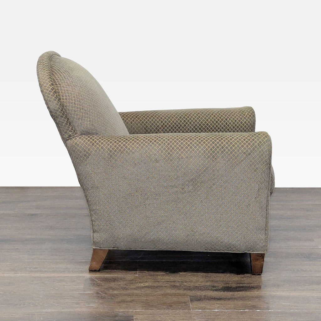 Stylish Crate & Barrel lounge chair, upholstered in soft, patterned fabric with wooden legs; gently used condition.