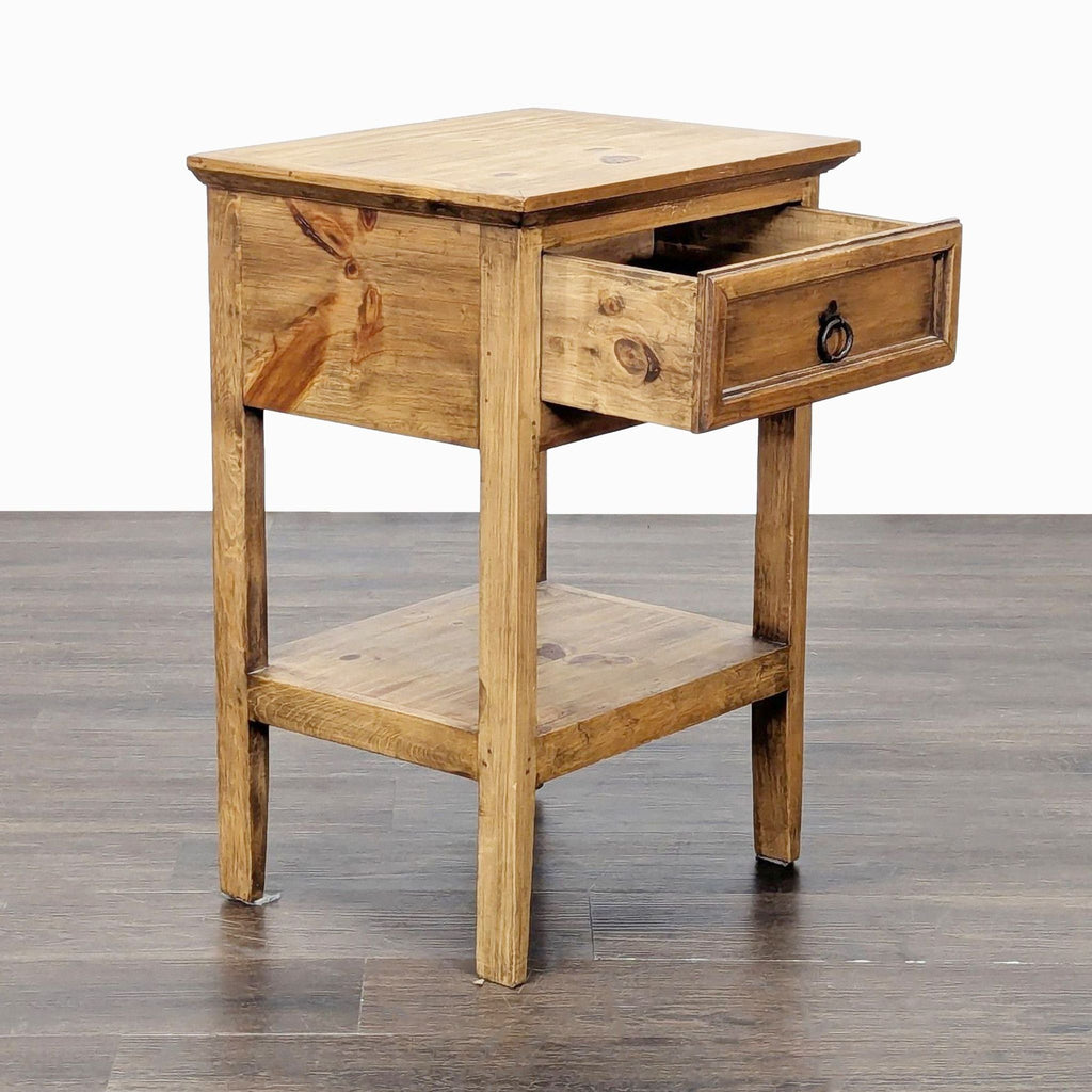 2. Angled view of a Pottery Barn end table with the drawer partially open and a lower storage shelf visible.