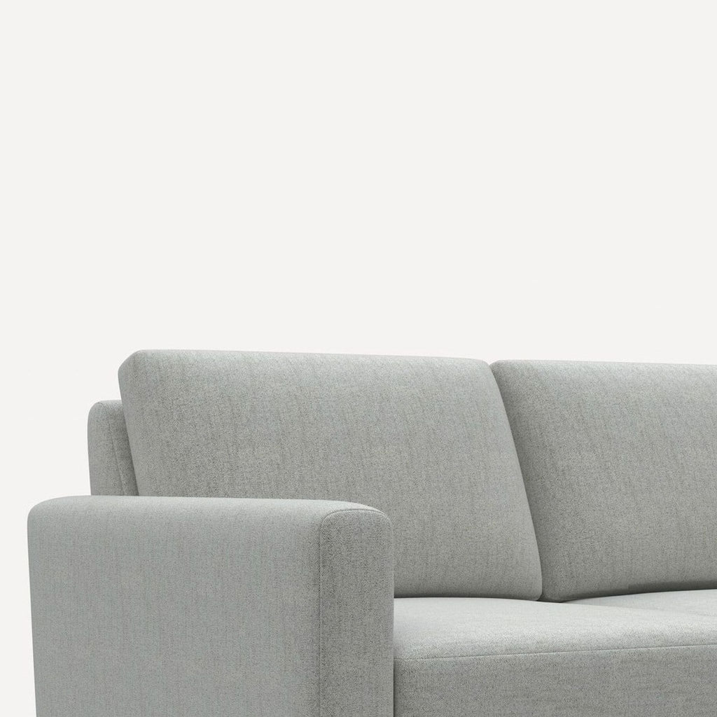 Burrow 4-seat sofa in soft gray fabric, featuring sleek gold legs and plush cushions for style and comfort.
