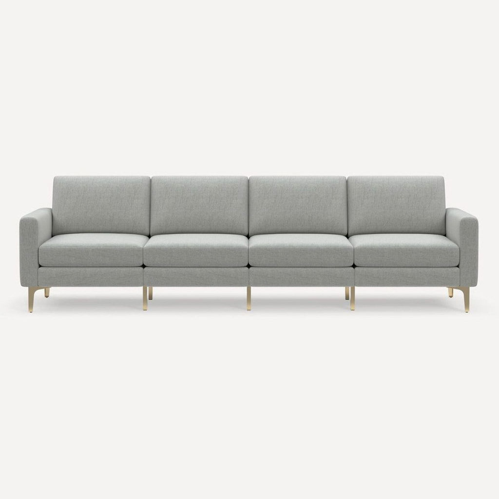 Modern light gray Burrow 4-seat sofa with brass legs, designed for comfort and style in any living room.