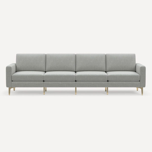 Modern light gray Burrow 4-seat sofa with brass legs, designed for comfort and style in any living room.