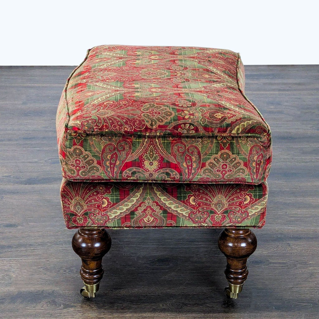 Detail of classic Lillian August turned legs, each fitted with metal casters.