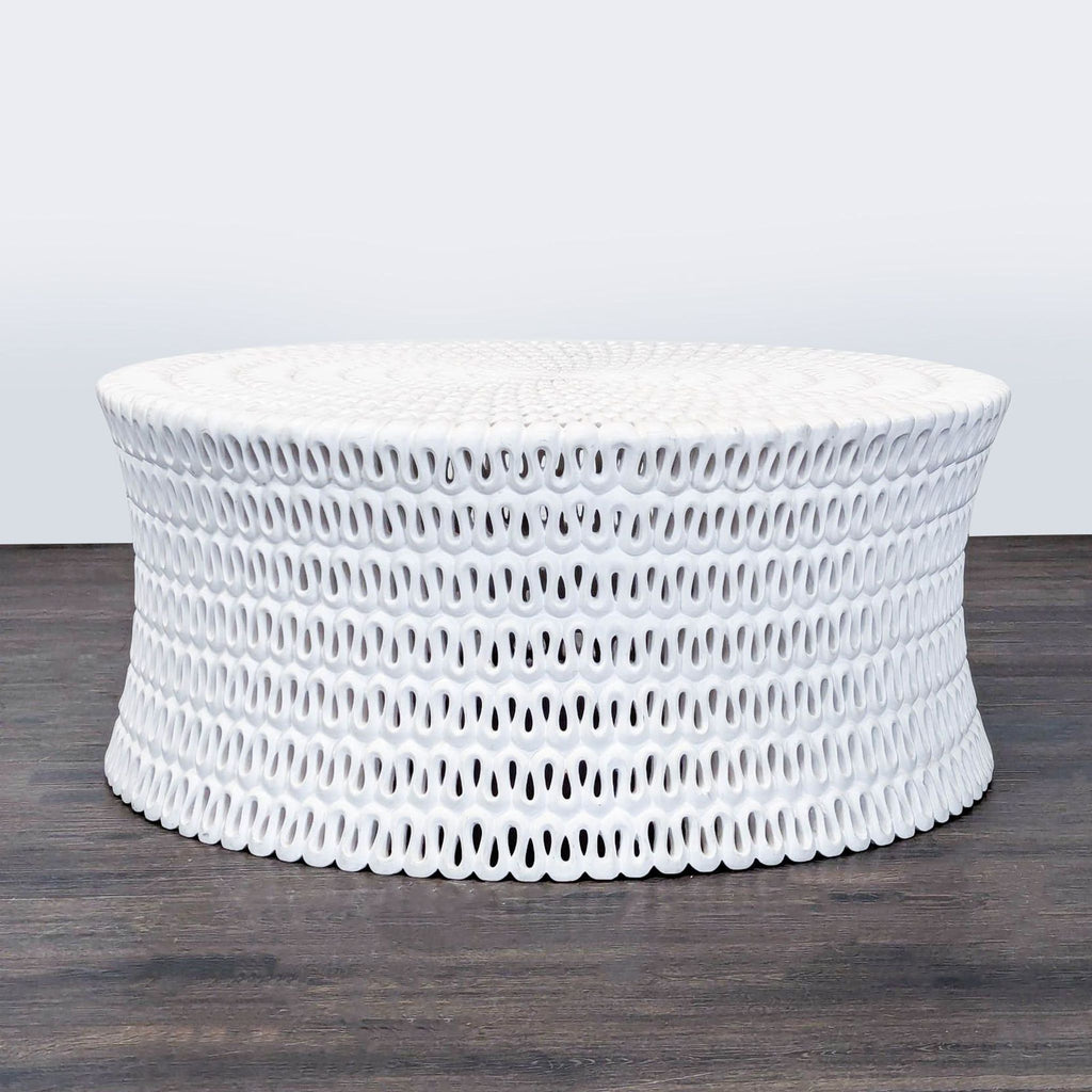 2. Modern Oly Studio coffee table made of cast resin, featuring a circular, pierced design and sculptural sides.  