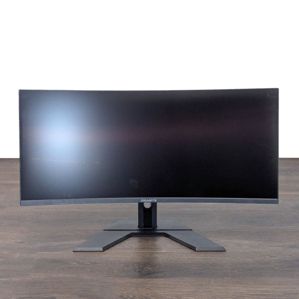 Gigabyte 34-inch curved ultra-wide monitor with sturdy stand, ideal for multitasking or gaming setups.
