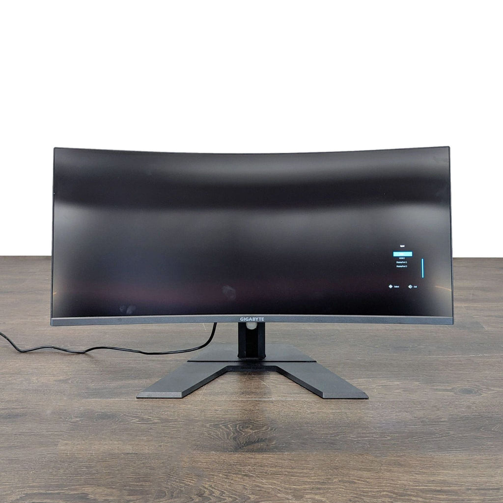 Ultra-wide 34-inch Gigabyte monitor with curved design, perfect for immersive home or office use.