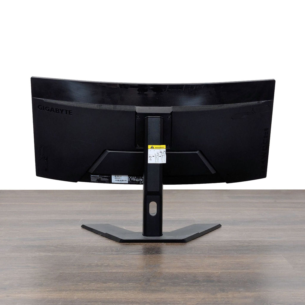 Gigabyte curved monitor with wide display and easy controls, great for productivity or entertainment.