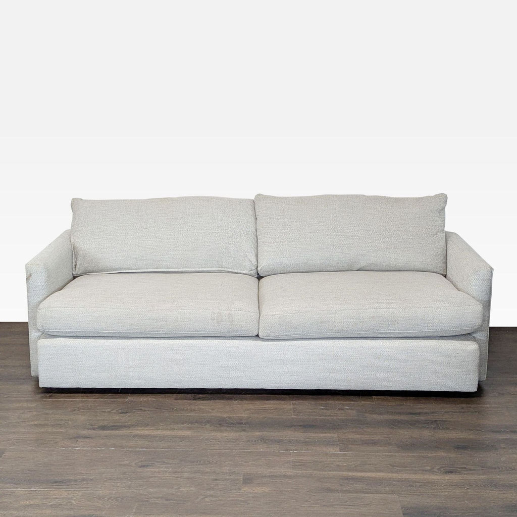 Crate & Barrel 3-seat sofa with straight arms and neutral fabric, showing minor wear on the arms.