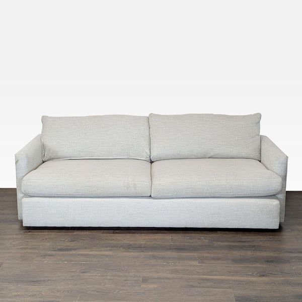 Crate & Barrel 3-seat sofa with straight arms and neutral fabric, showing minor wear on the arms.
