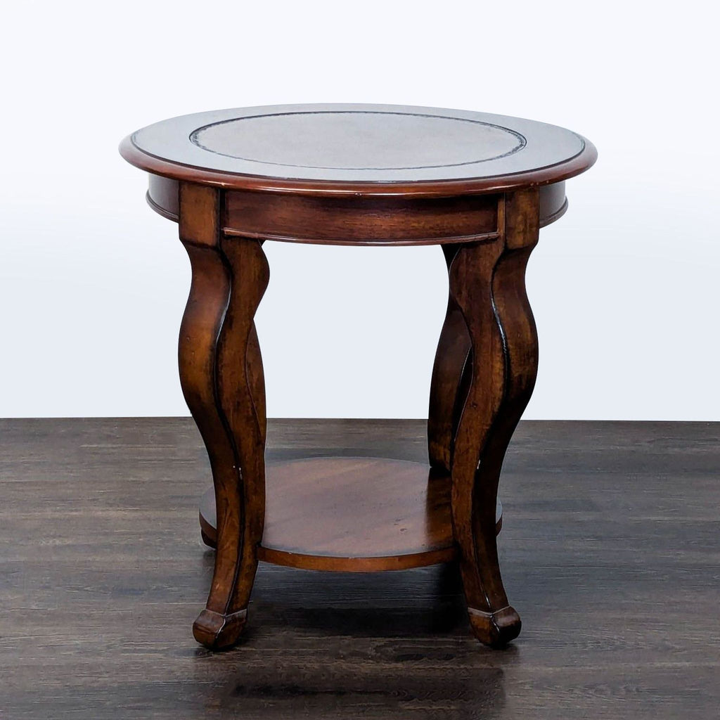 Classic wooden end table featuring curved cabriole legs and a smooth rectangular top.  