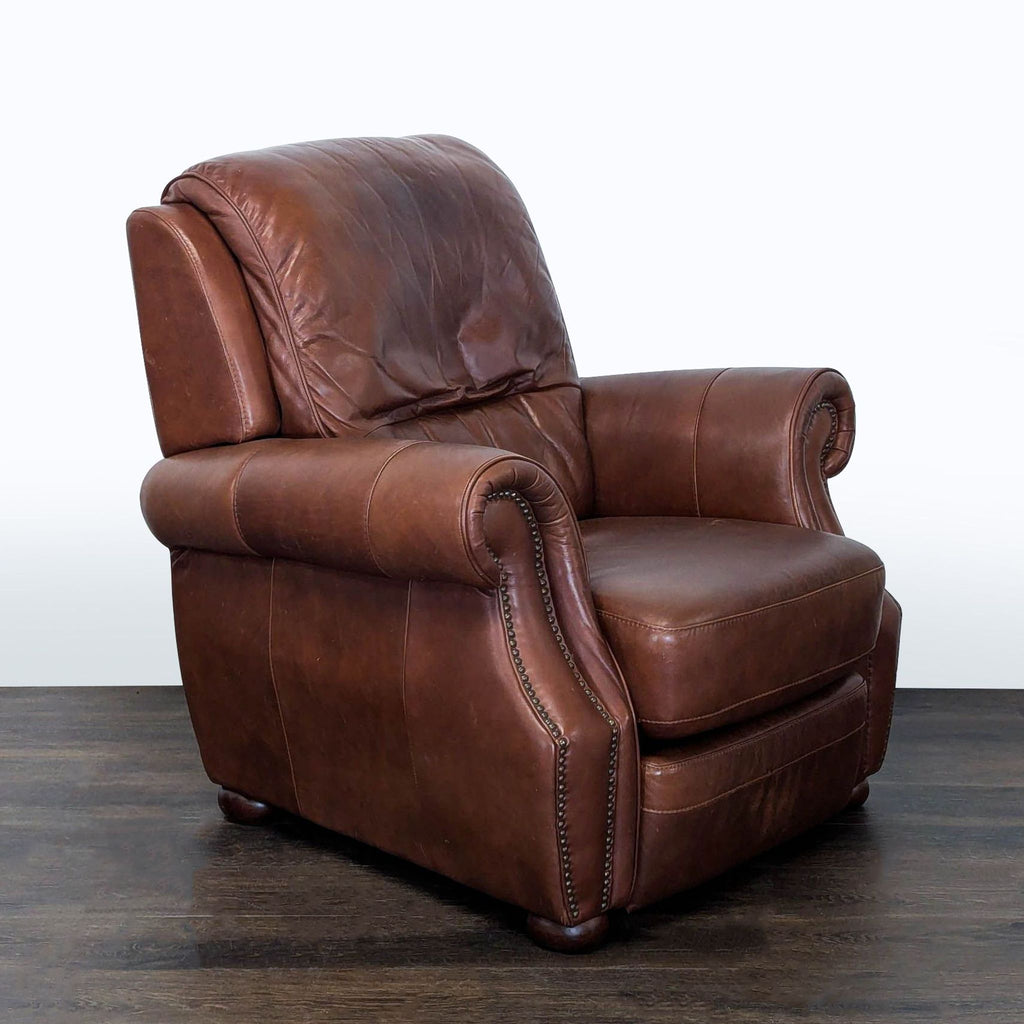 Elegant brown leather lounge chair with comfortable padding, decorative nailhead accents, and reclining feature.