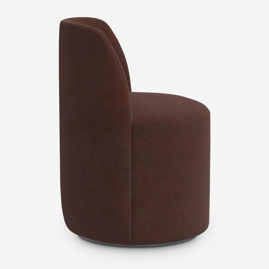 Wine mini corduroy upholstered dining chair features clean lines, a curved back, and swivel base from Lulu and Georgia.