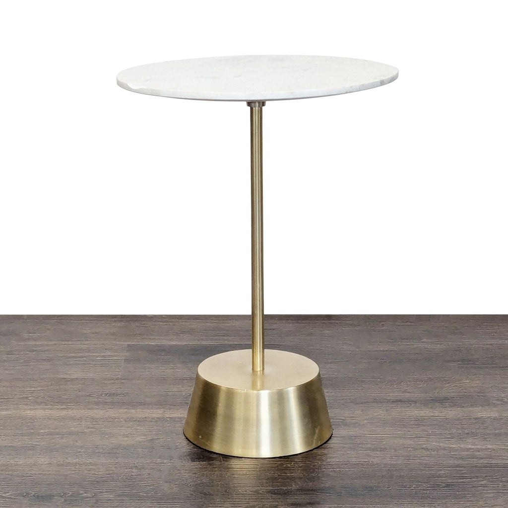 West Elm side table with a marble top and sculptural antique brass metal base.  