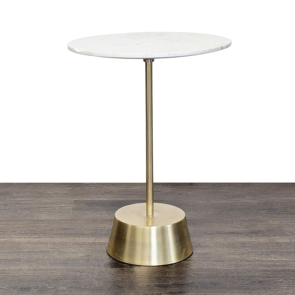 West Elm side table with a marble top and sculptural antique brass metal base.  