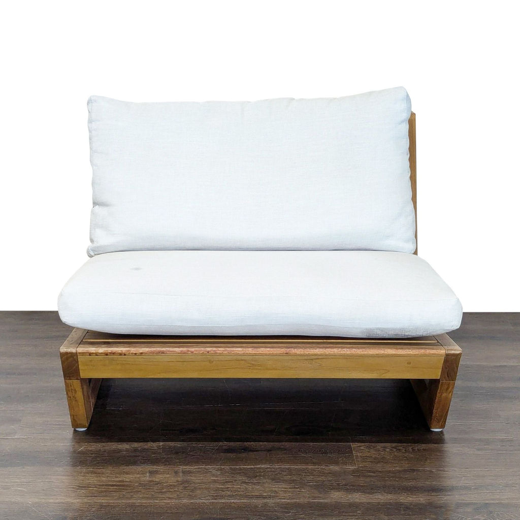 Crate and Barrel outdoor chair with a wooden frame and plush white cushions, modern and gently used.  