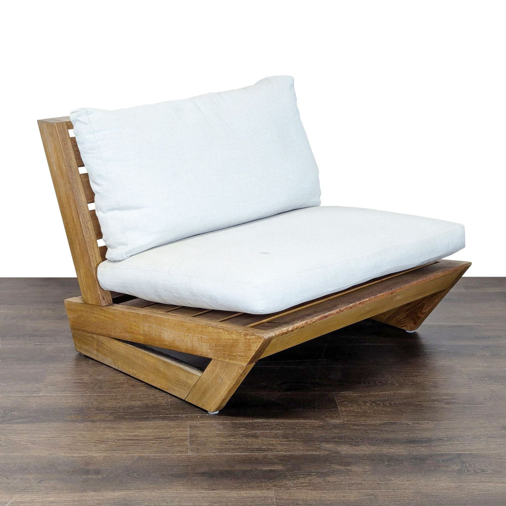 Modern Crate and Barrel lounge chair featuring thick white cushions and a sturdy, stylish wood base.  