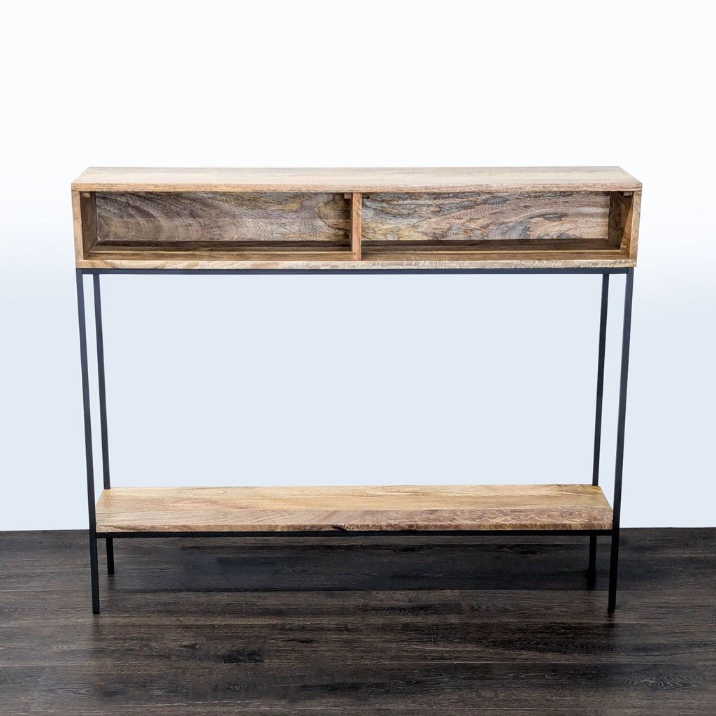 West Elm mango wood side table with black metal frame and two open cubbies.  
