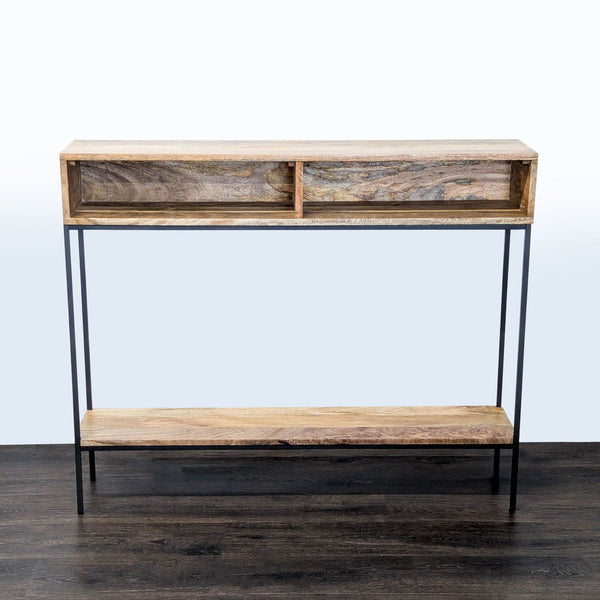 West Elm mango wood side table with black metal frame and two open cubbies.  