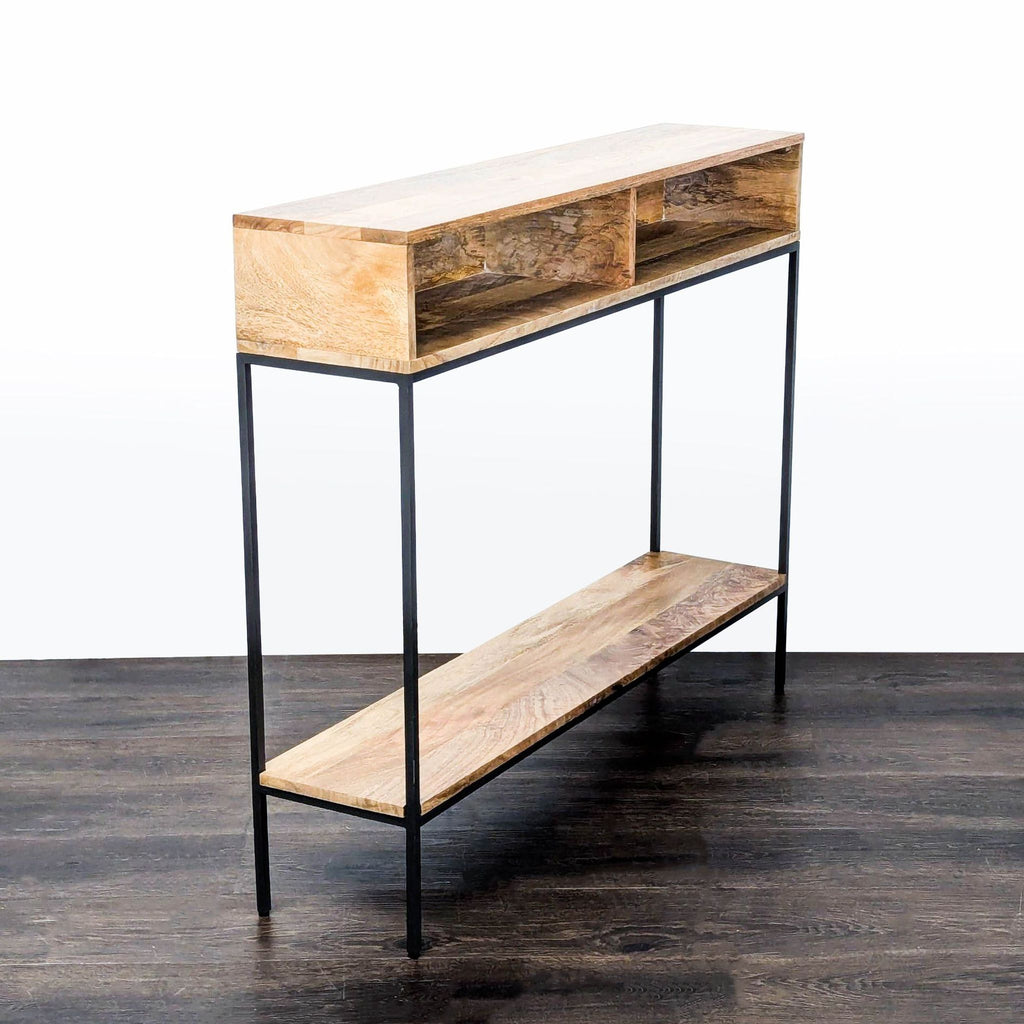 Modern side and console table featuring mango wood and a blackened metal frame with open storage spaces.  