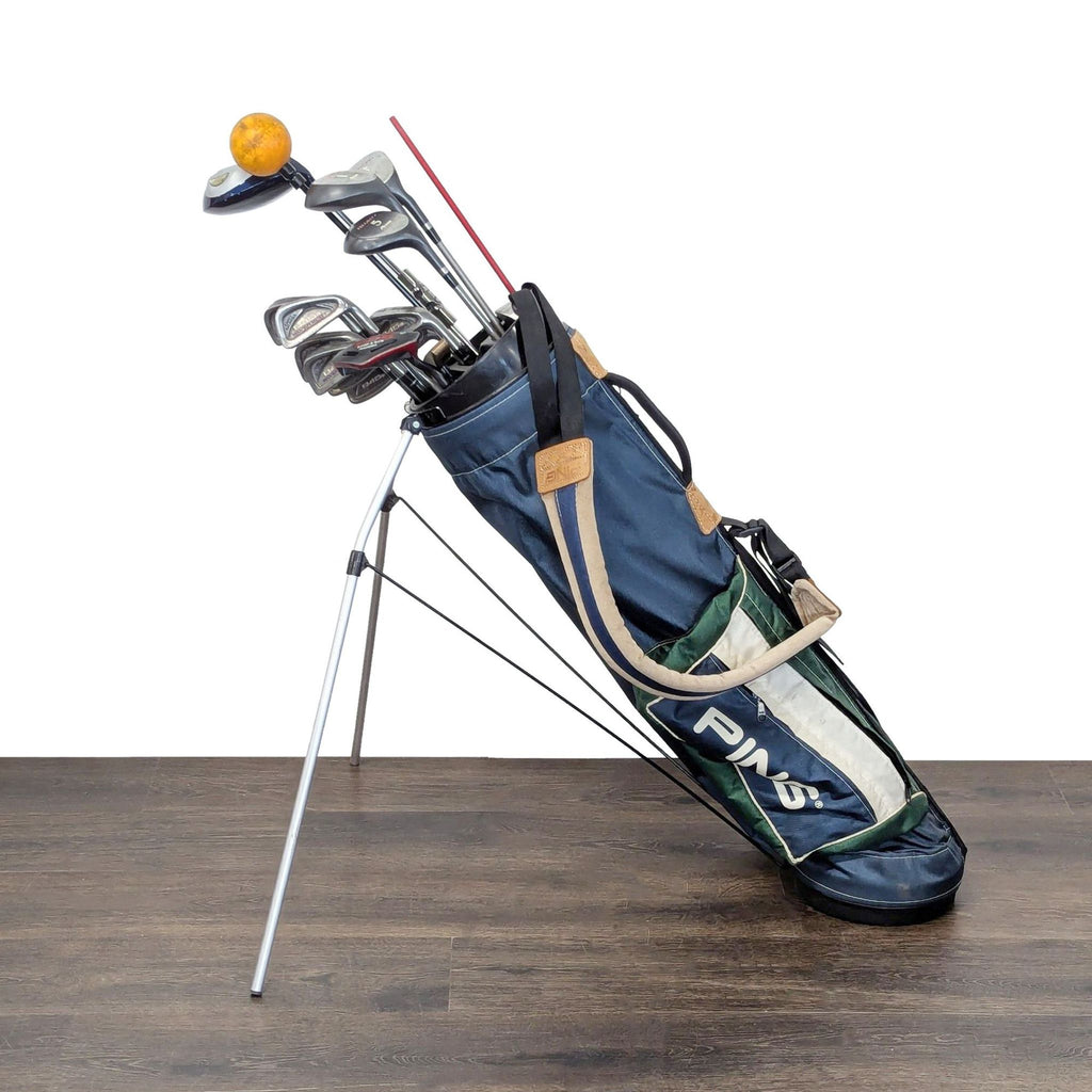 2. Golf club set in a stand bag with PING and The Olympic Club branding; includes straps for easy carrying.  