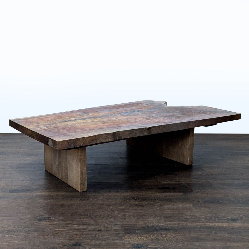 1. Rectangular live-edge wooden coffee table by Hudson Furniture with a thick slab top and wide block legs.  