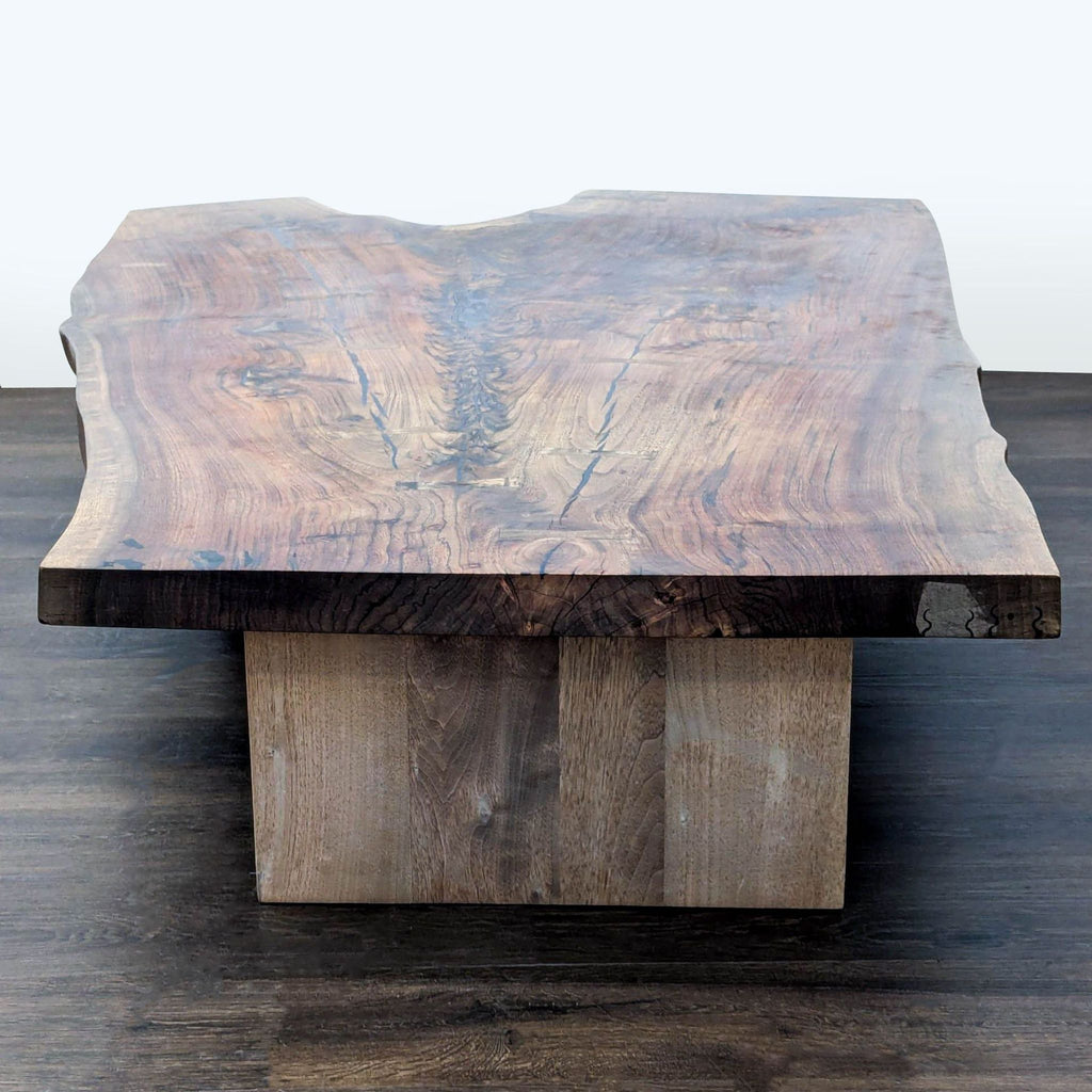 2. Front view of a rustic Hudson Furniture coffee table, featuring a natural wood grain and sturdy square base.