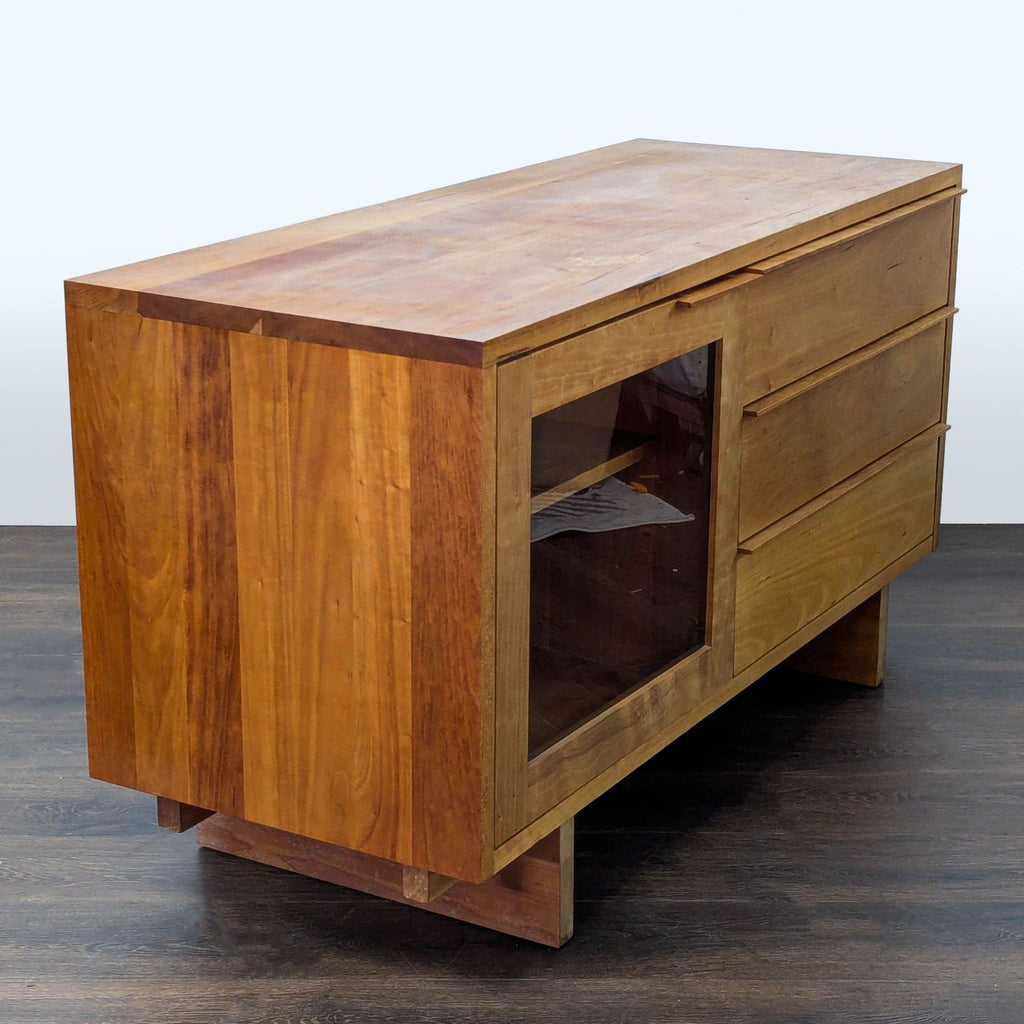 Modern sideboard with glass cabinet door, triple drawers, and shelves, Room and Board brand.