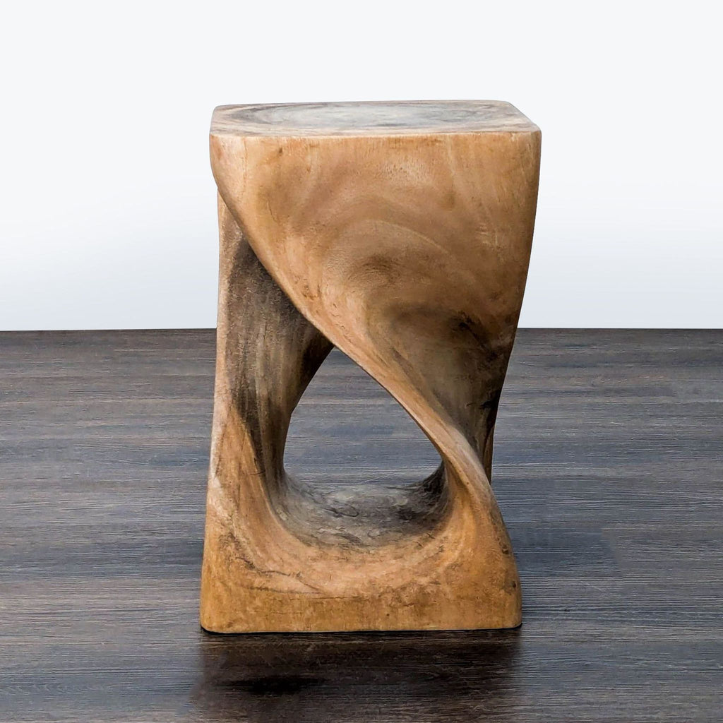 2. West Elm wooden end table featuring a smooth, curved twist and square top, displayed upright.  