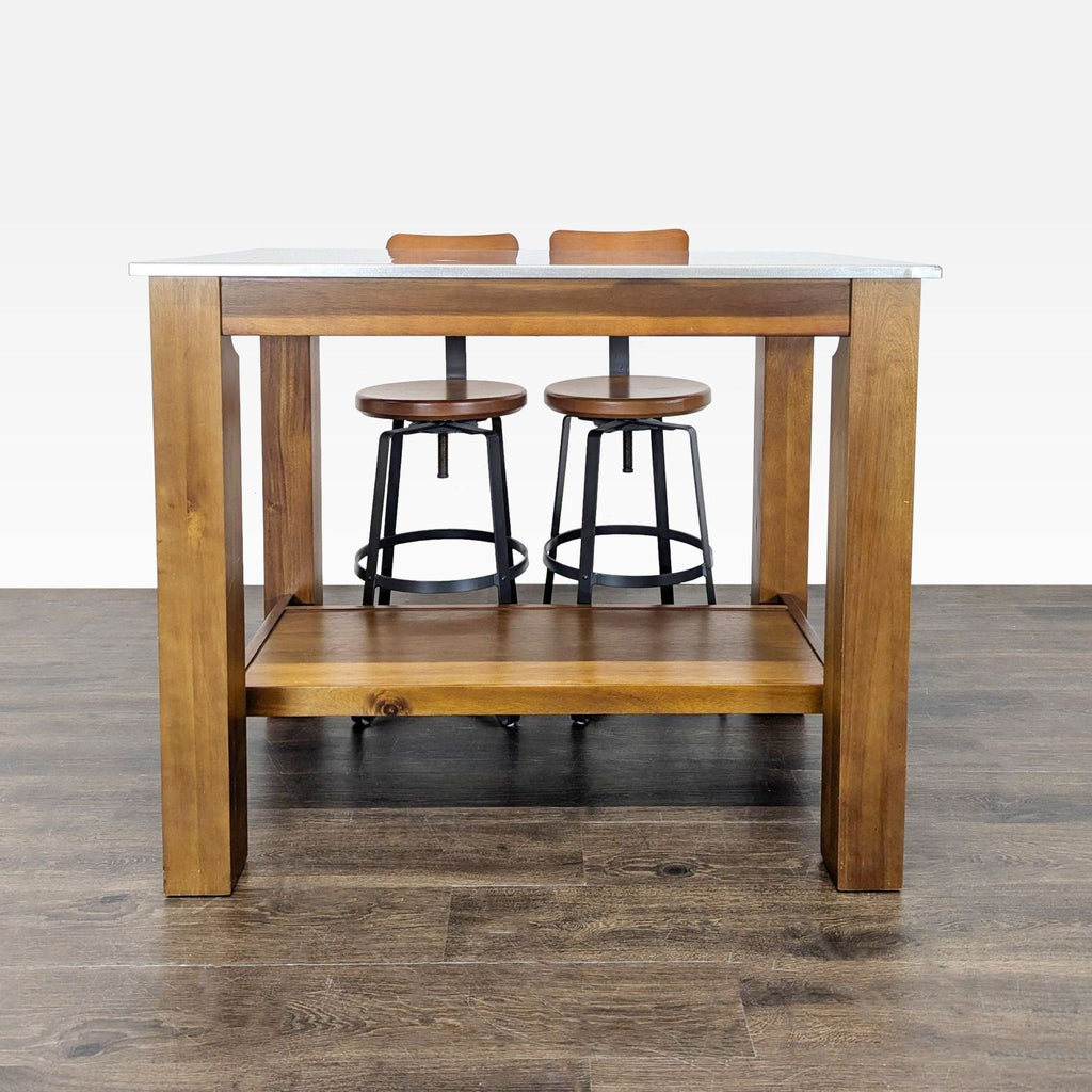 Modern dining set with a wooden table, two bar stools, and a storage shelf, ideal for small dining areas.  