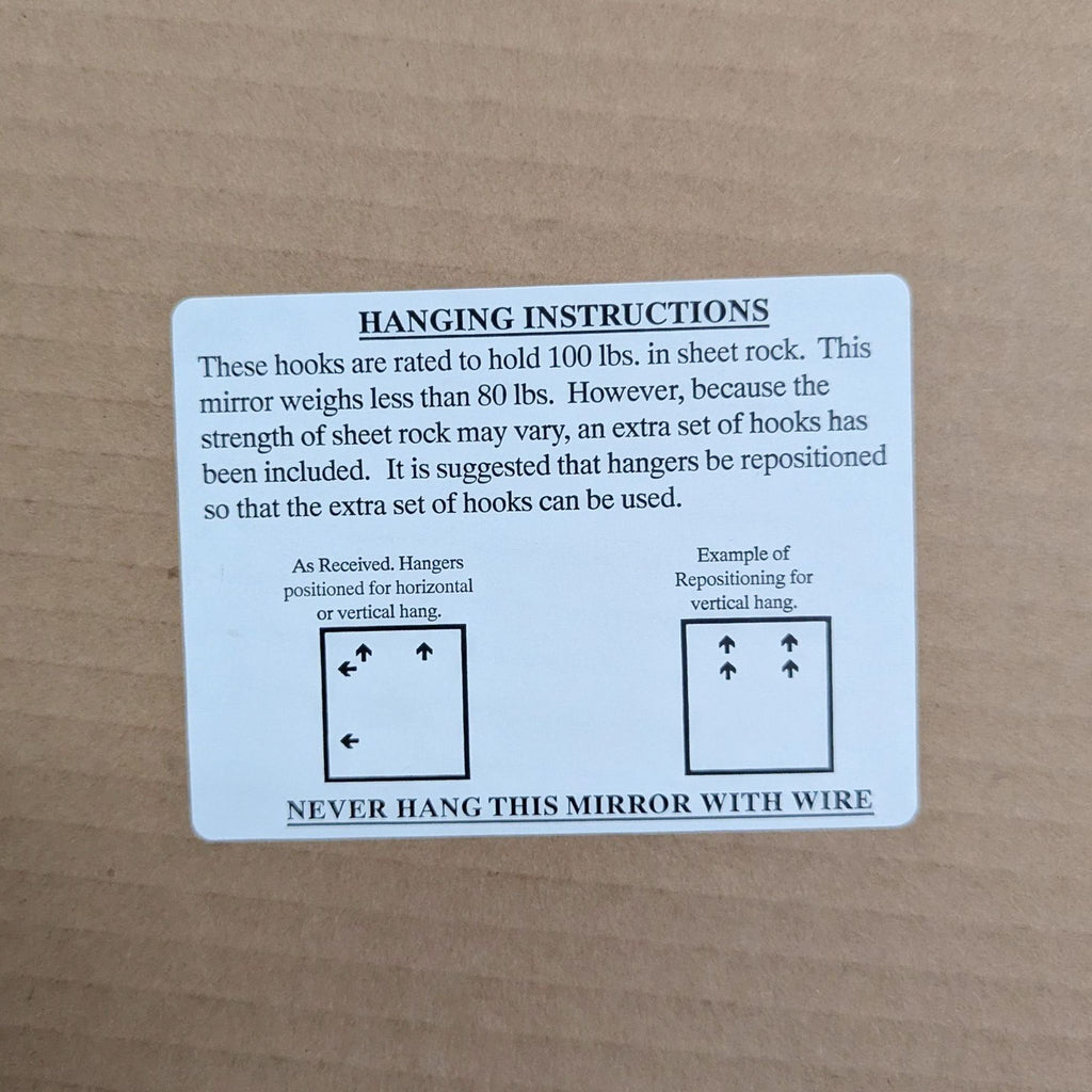 3. Hanging instruction label for the mirror, detailing weight capacity and hanger positioning illustrations.