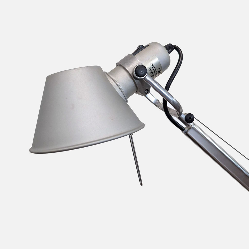 Modern Artemide floor lamp in chrome with sturdy base, adjustable arm, and directed cone shade; Lighting.  