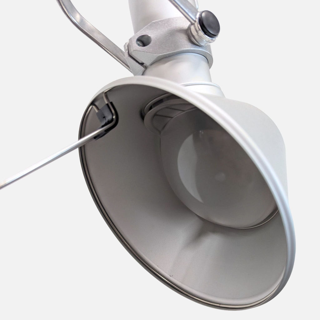 Modern lighting: Artemide adjustable floor lamp in silver finish with sturdy base and flexible arm.