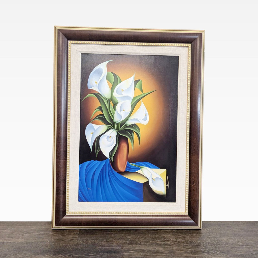 Framed print by Noel Suarez of white calla lilies in a brown vase with blue and yellow drapery background.