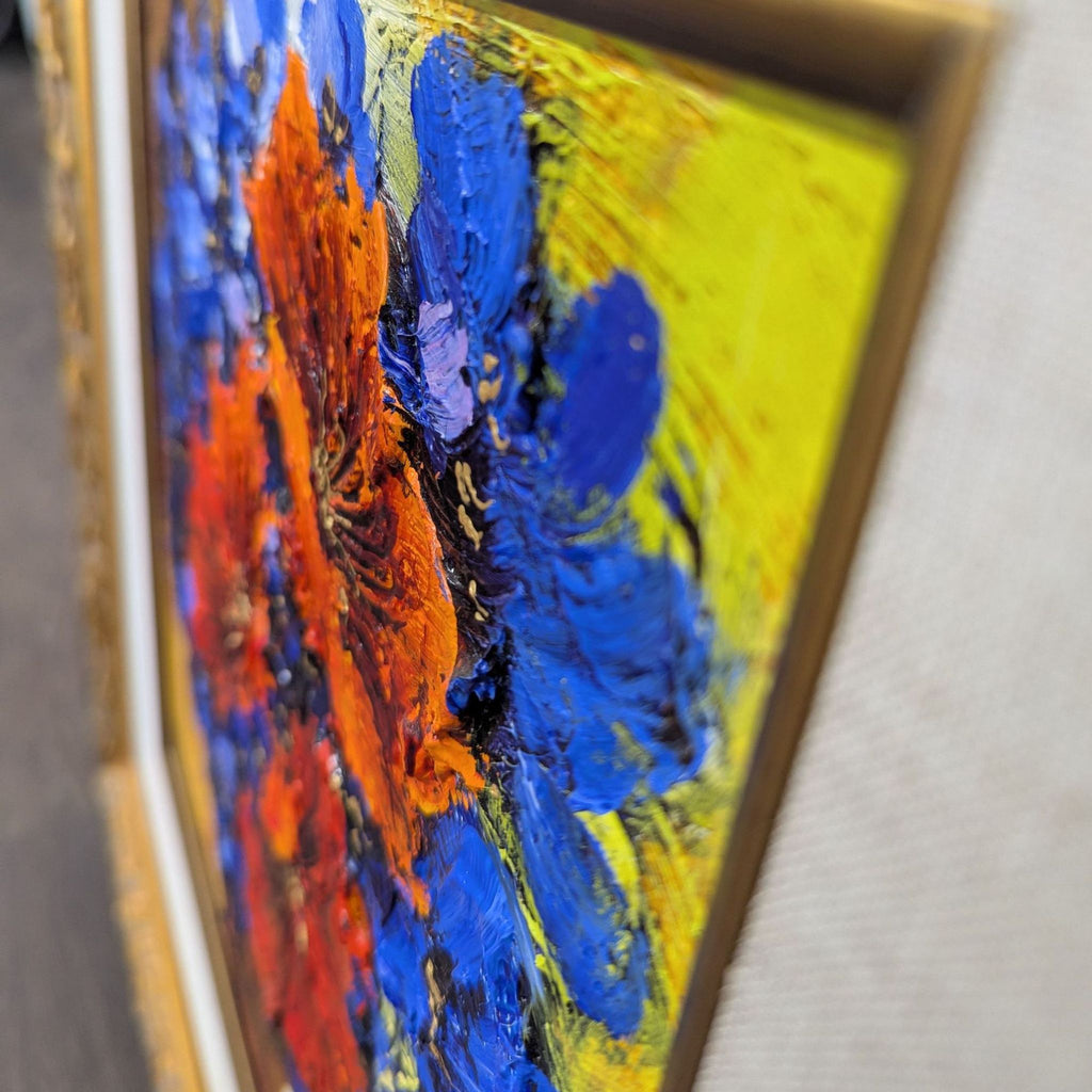 Floral artwork by Yana Korobov: bright bouquet in brown vase, displayed in an ornate black and gold frame.