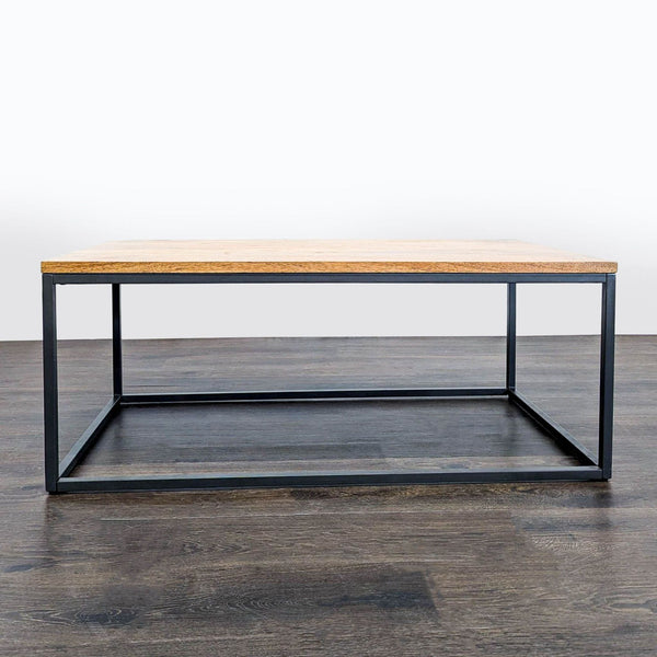 1. Industrial coffee table by West Elm with wood top and blackened steel base, shown on a dark wood floor.  