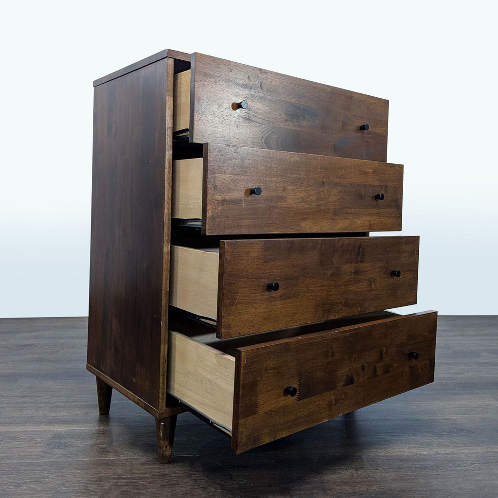 Classic dresser in rich brown wood, featuring four spacious drawers and simple black handles for a sleek look.