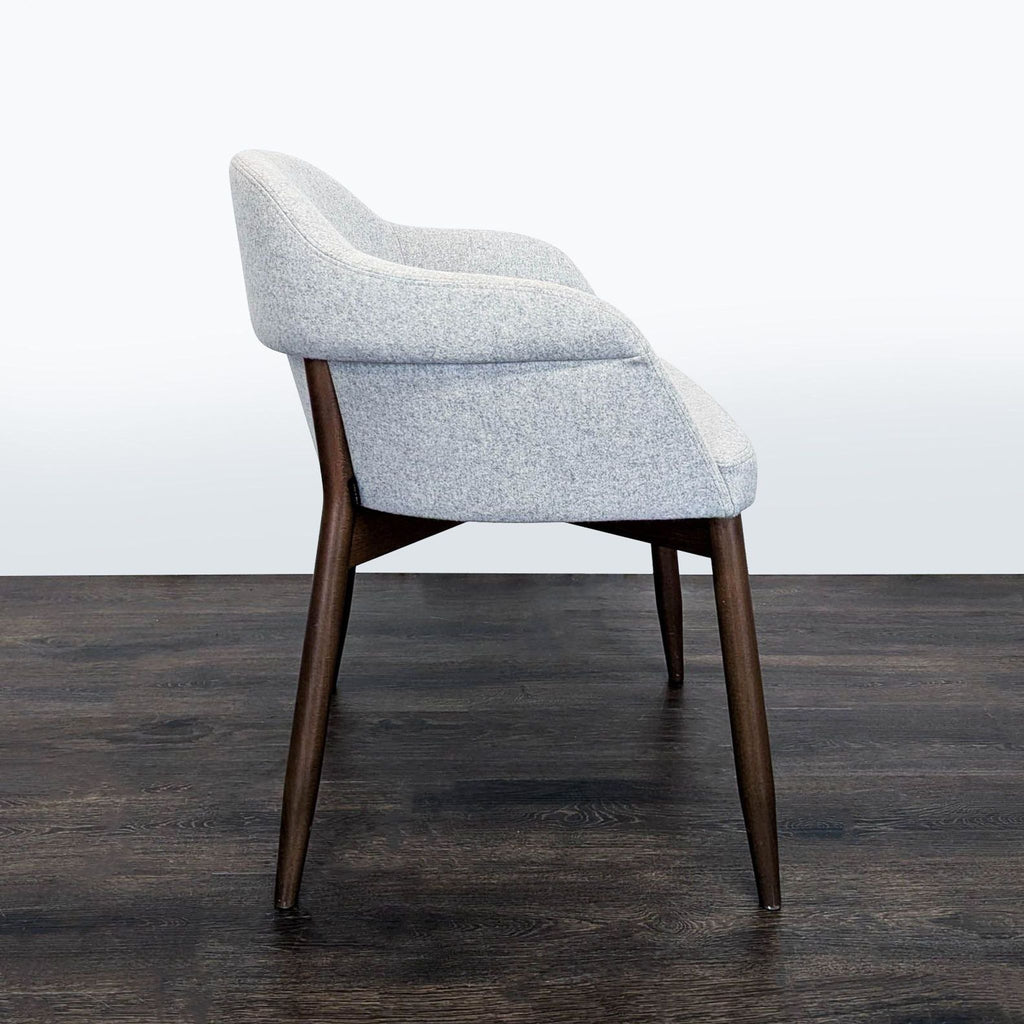 3. Upholstered Billiani dining chair with gently splayed wooden legs and a curved seat, ideal for dining rooms.