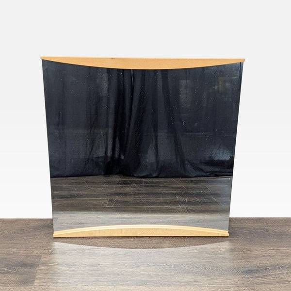 1. Square Calligaris mirror with cherry wood frame, designed by Edi and Paolo Ciani, front view on wood floor.  