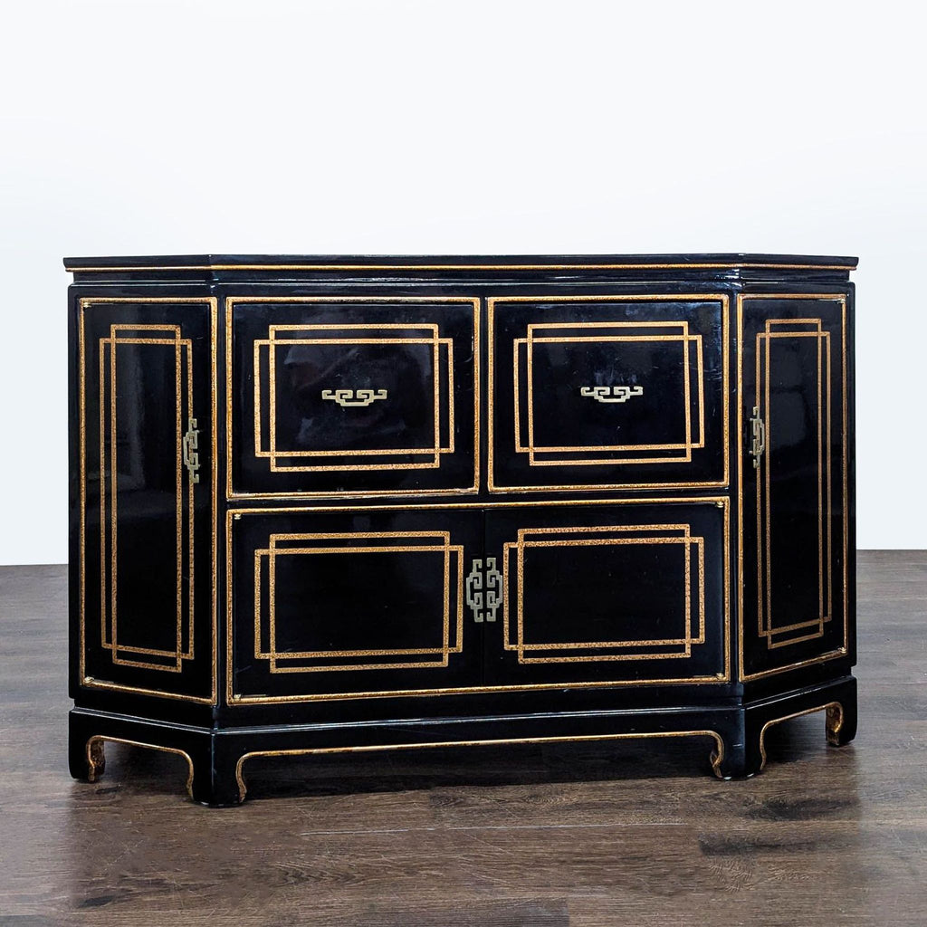 Black lacquer Chinoiserie credenza with gold details, geometric panels, and Asian-style hardware, ideal for storage.