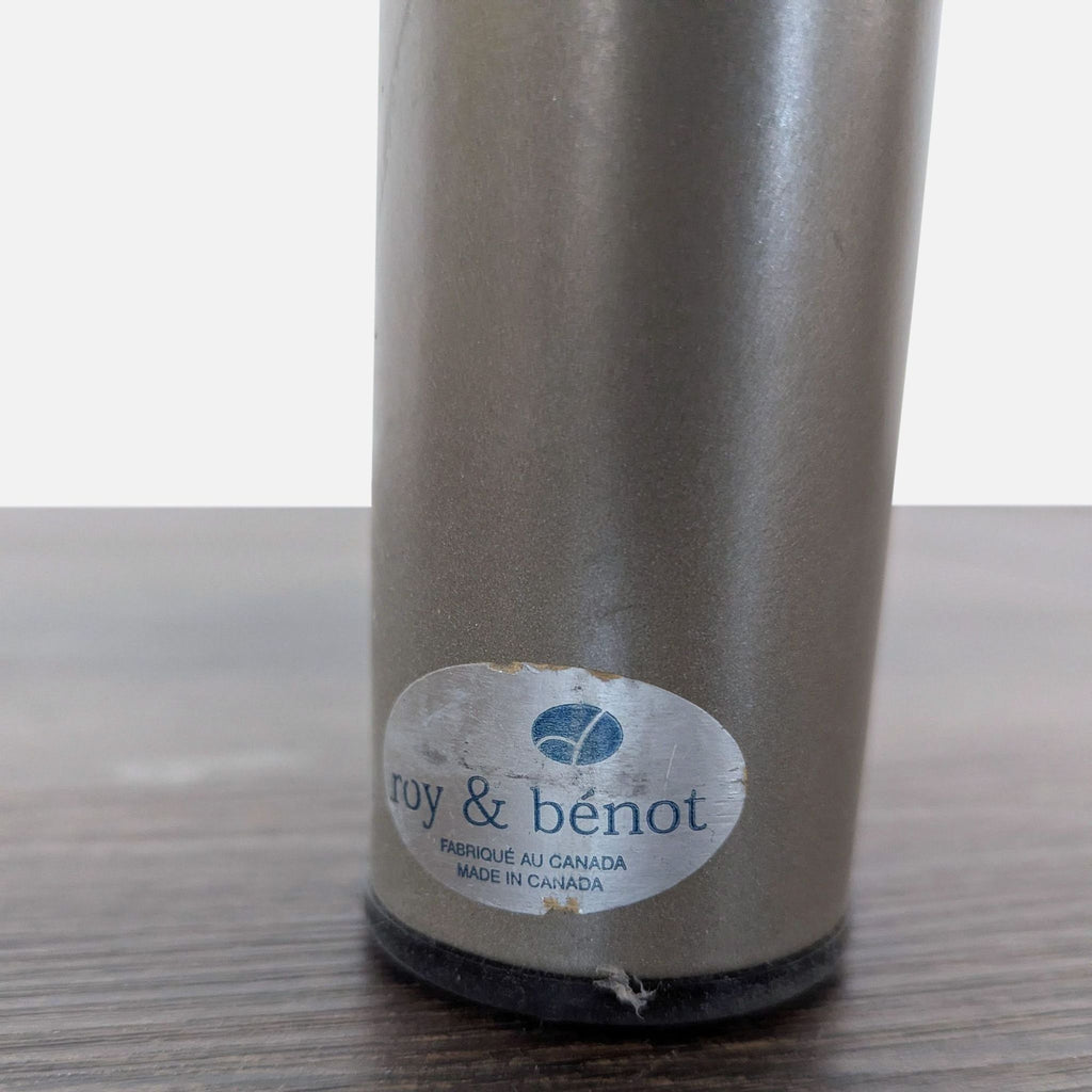 2. Close-up of Roy & Bénot brand label on a metallic table leg, with "Made in Canada" printed below.