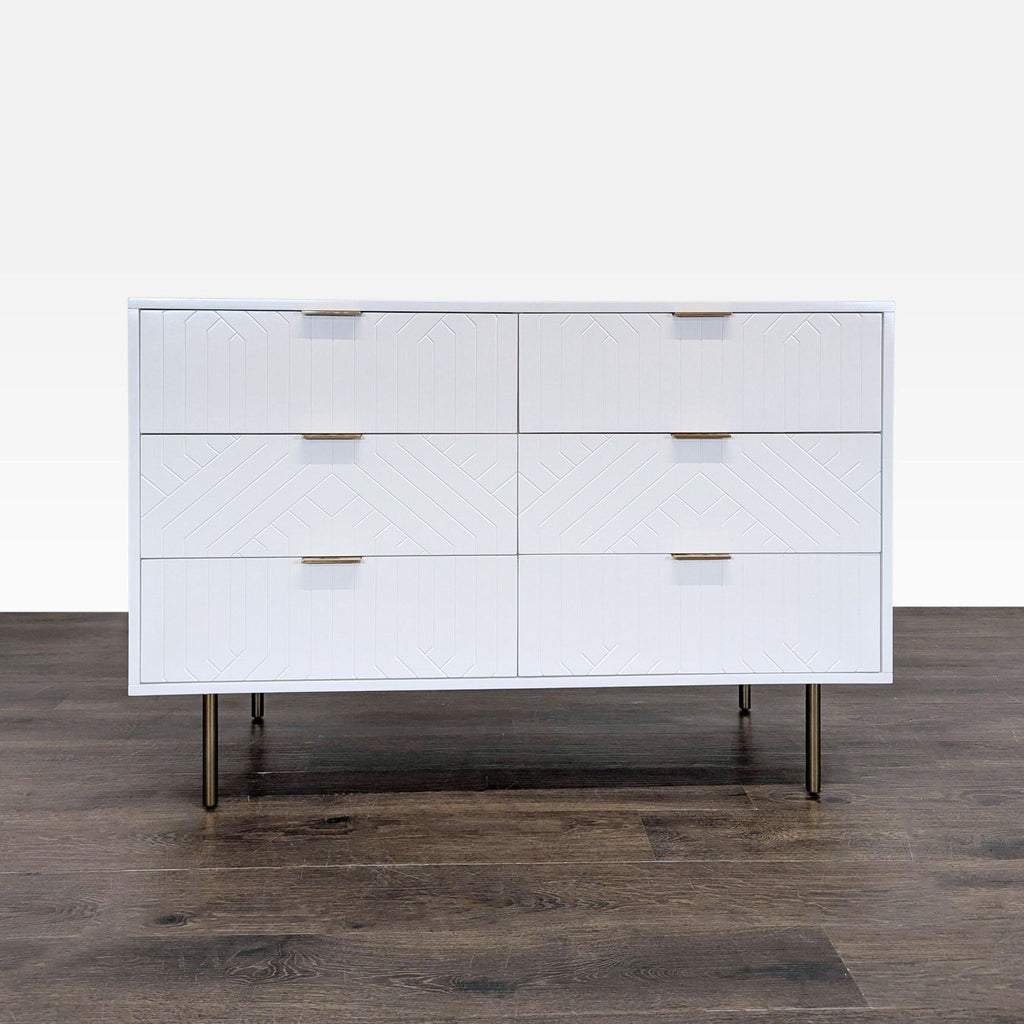 White Pottery Barn dresser with six drawers, geometric design, and brass legs; minor scratches on top.  