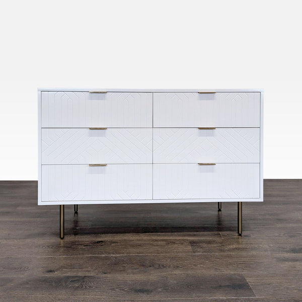 White Pottery Barn dresser with six drawers, geometric design, and brass legs; minor scratches on top.  