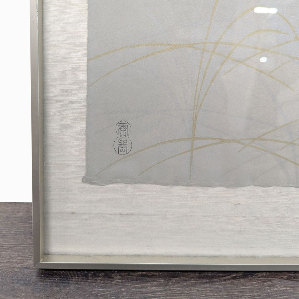 2. Close-up of gold grass details and traditional artist’s stamp on textured Japanese print.  