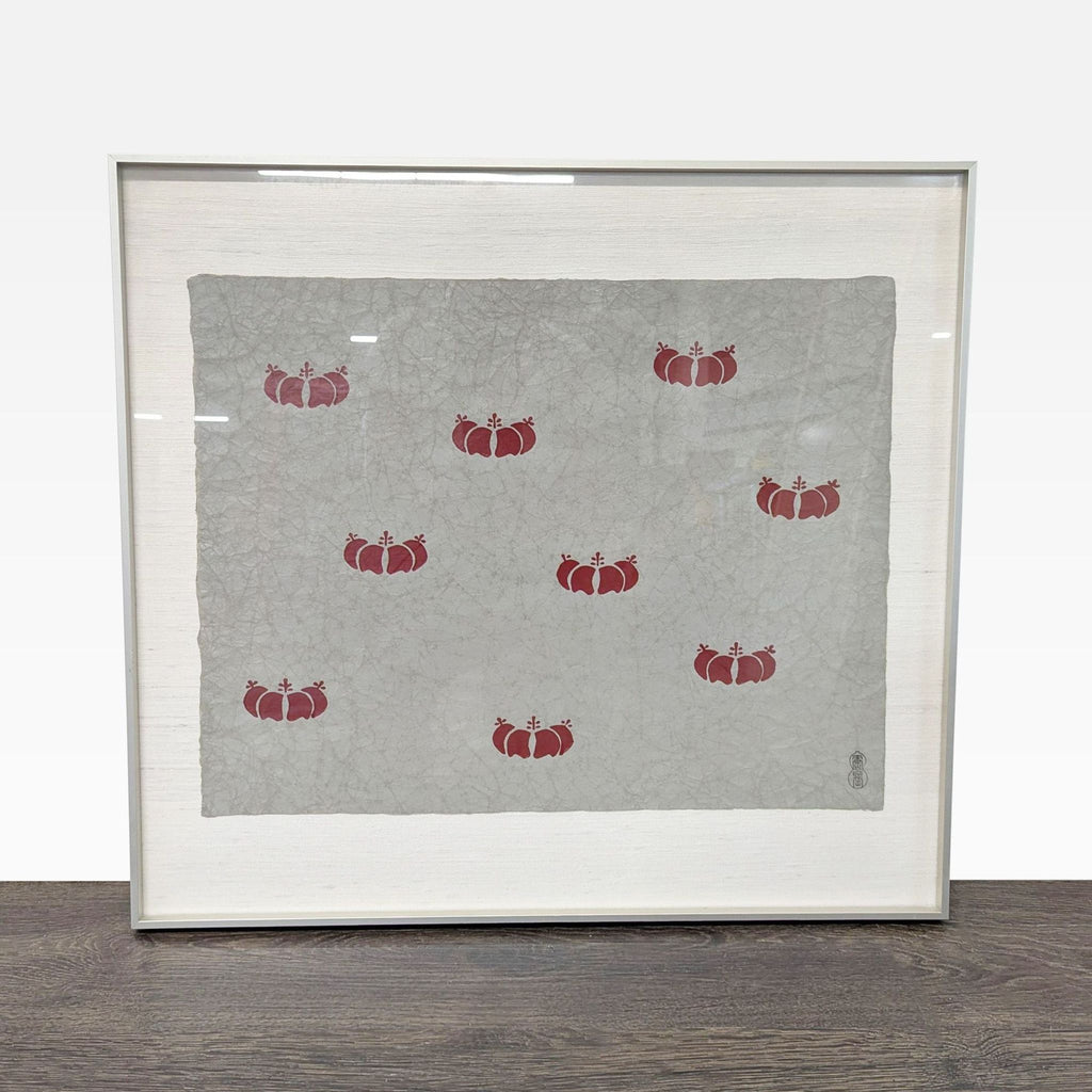 Red pomegranate pattern art print on textured gray paper, framed with cream mat and artist seal visible.