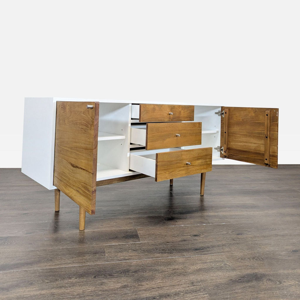 Modern wood and laminate credenza, features three drawers and two cabinets, fits Sideboard & Credenza category.  