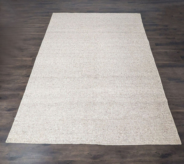 Cream and beige Lulu and Georgia rug with a soft, textured weave, ideal for any stylish living space.