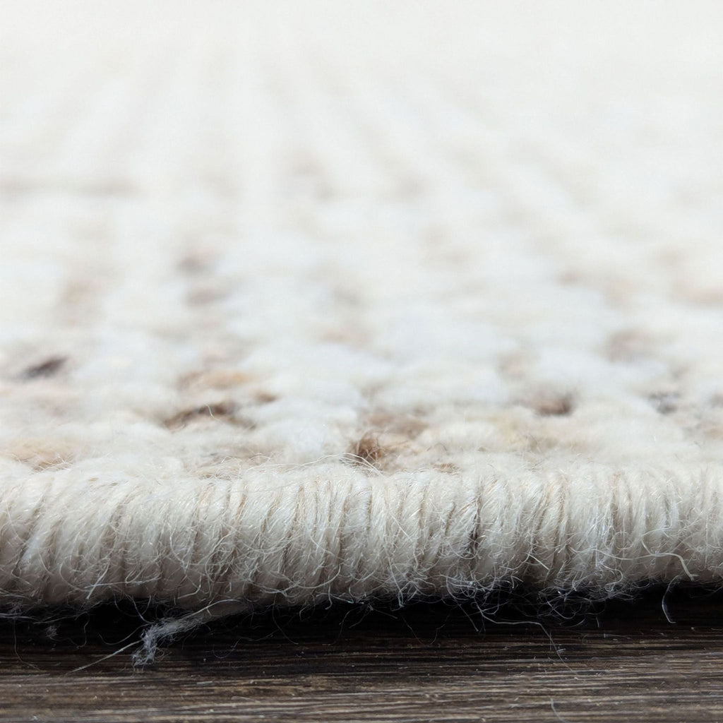 Lulu and Georgia brand rug in cream and beige, featuring a cozy, durable weave to enhance modern home decor.