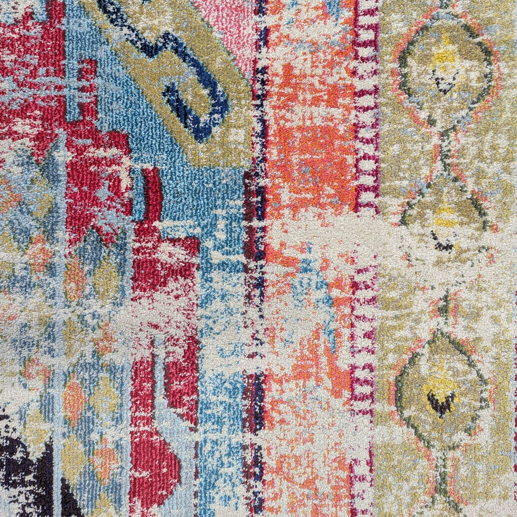 Turkish-made 9' x 12' rug in bright colors and modern style, durable polypropylene construction for easy care.