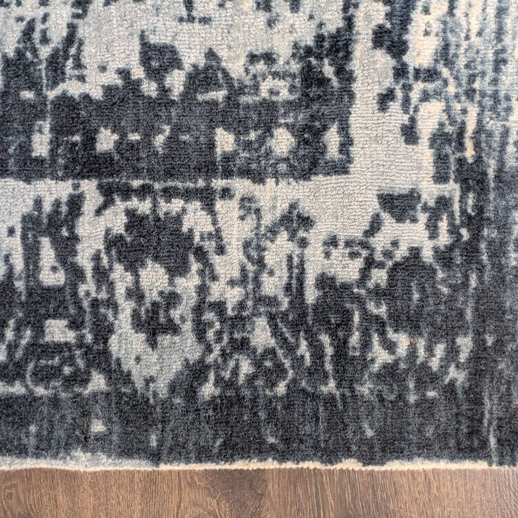 Distressed blue and ivory pattern West Elm rug, 8x10, blends a vintage trellis look with easy-care construction.
