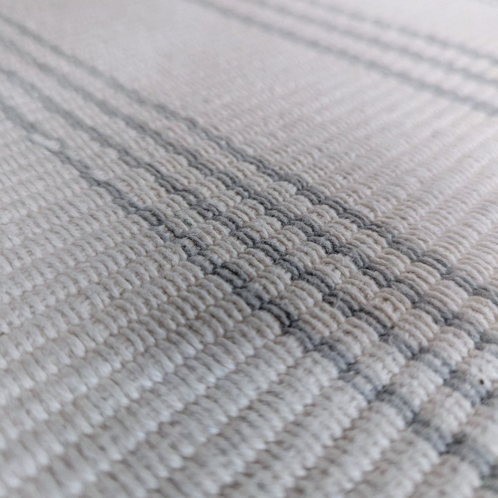 Dash and Albert rug featuring an ivory base and grey stripes, perfect for a subtle, modern room accent.  