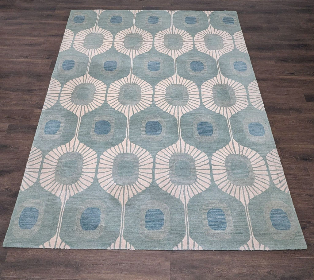 Modern blue and cream Bashian rug with geometric pattern; soft texture, ideal for home living spaces.